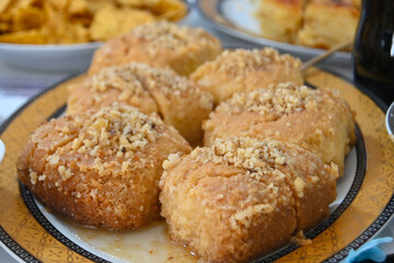 homemade Turkish Dessert Sekerpare , Small cakes with walniuts and Sherbet Syrup