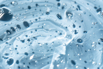 Gel serum texture clear blue liquid skincare cream background cosmetic gel product with bubbles