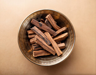 Agarwood  sticks in a bronze bowl top view, 