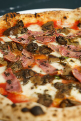 Close up of Original Italian pizza with tomato sauce and ham