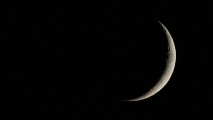 Waxing crescent moon seen with telescope