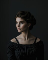 Naklejka premium woman in a black dress, posing gracefully, capturing elegance and sophistication in a timeless fashion shot