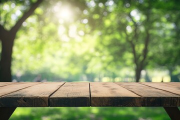 Fototapeta premium Empty wood table top and blurred green tree in the park garden background - can used for display or montage your products, ai