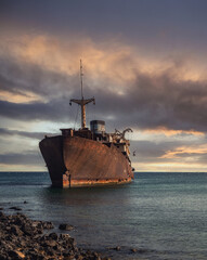Young teenager jumping overboard from shipwreck
