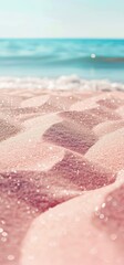 Fototapeta premium Close-up shiny sand with wavy pattern on the surface and sea ​​surf in the distance.