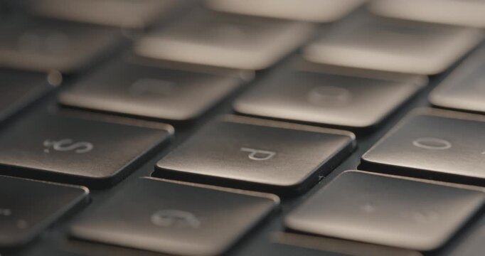 Woman hand typing on laptop computer keyboard