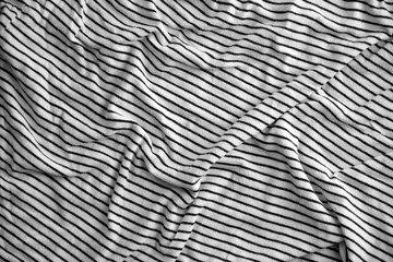 Processed collage of abstract black and white stripped cloth background with many folds