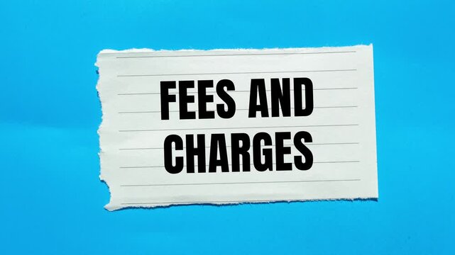 Fees and charges message writing on ripped torn paper on blue background