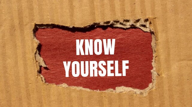 Know yourself message writing on ripped torn cardboard paper on brown background