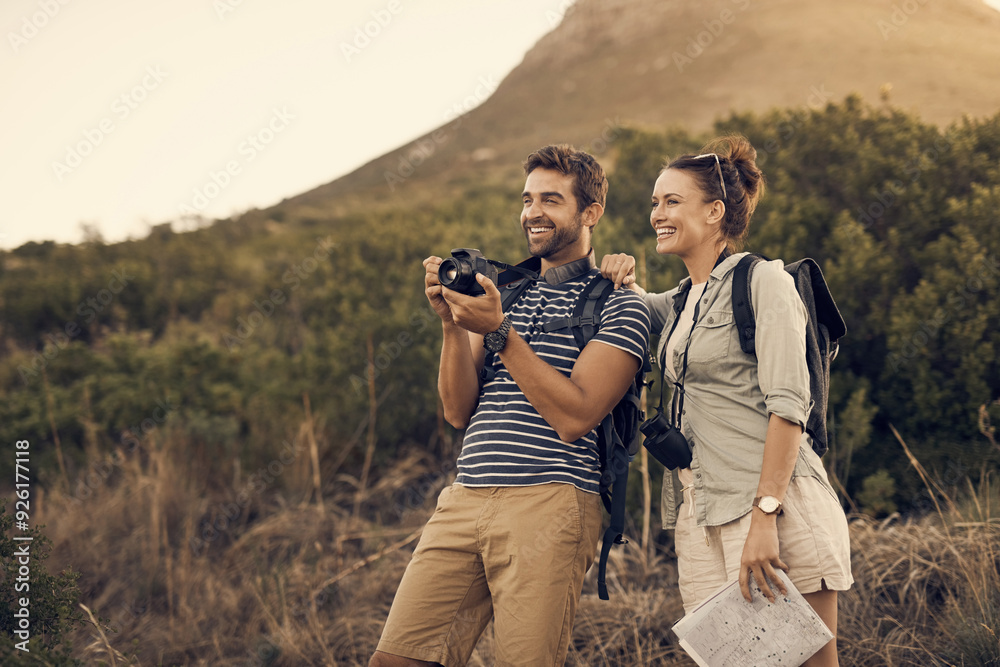 Poster Outdoor, couple and happy for photography on mountain of view with camera for trip, journey documentation and adventure. Man, woman and travel together in nature for explore, destination and hiking.