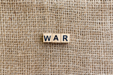 War Message on Wooden Blocks with Burlap Texture