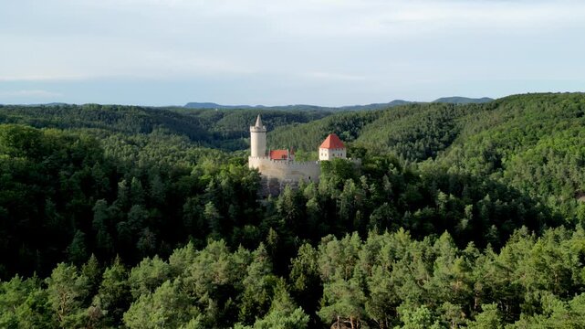 Aerial footage of Kokorin Castle nestled in lush forests in Kokorin village, Czech Republic