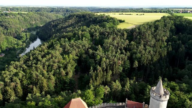 Aerial footage of Kokorin Castle nestled in lush forests in Kokorin village in the Czech Republic
