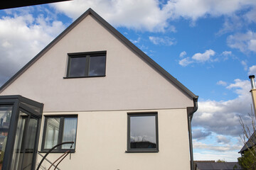 Facade of modern renovated house in early spring.