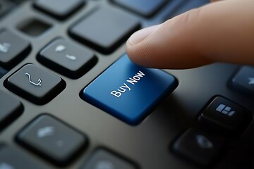 Close-up of a finger pressing the blue "Buy Now" button on a keyboard, representing e-commerce and online shopping