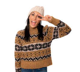 Young beautiful woman wearing winter sweater standing over transparent background smiling with happy face winking at the camera doing victory sign. Number two.