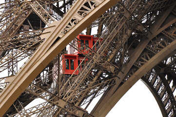 The elevator inside the Eiffel Tower, showcasing its intricate steel structure and engineering marvel. It offers visitors a unique ascent with panoramic views of Paris, capturing the essence of this i