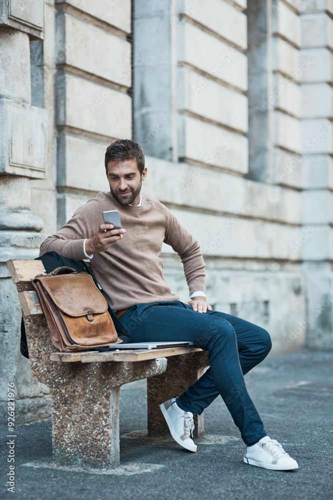 Poster businessman, street and smile with smartphone on bench with mobile app for ehailing cab in new york.