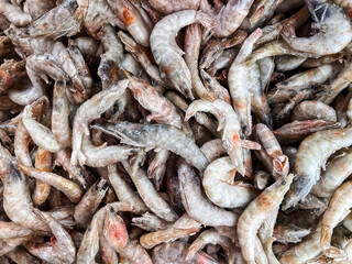 Frozen shrimps prawns. Raw shrimp background. Pile of frozen shrimps background.
