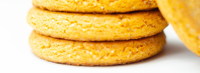 A stack of yellow cookies with a white background