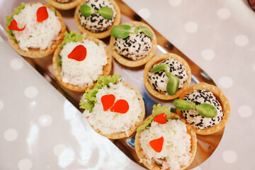 Tartlets with pate decorated with micro greens. Delicious and beautiful appetizers for a buffet table. catering services for banquets.