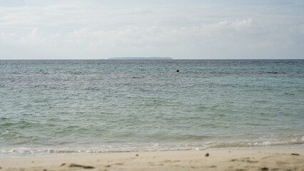 a view of a beach on the middle  pf the day