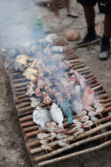 fish cooking on the beach