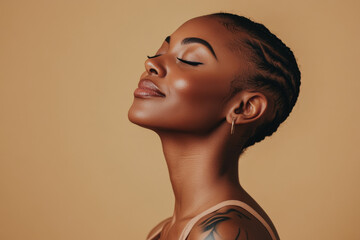 A close up of a tattooed black woman's face with her eyes closed