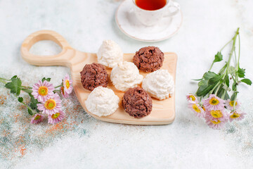 Delicious homemade meringue cookies with coconut flakes.