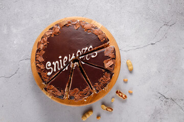 Snickers cake with caramel, peanuts and buttercream.