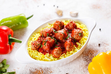 Chicken meatballs with tomato sauce.
