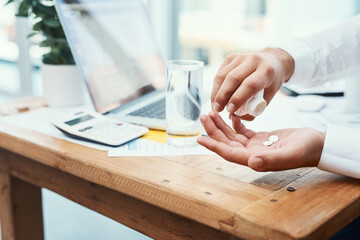 Fototapeta premium Businessperson, laptop and pills with water for medical prescription or daily dosage at office. Closeup of employee hands with mineral liquid for pharmaceutical treatment or medication at workplace