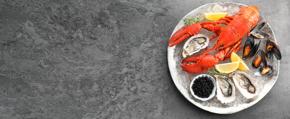 Many different fresh sea food on grey table, flat lay. Banner design with space for text