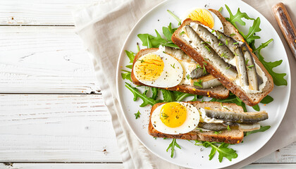 Sandwich with sprats and egg on wooden table