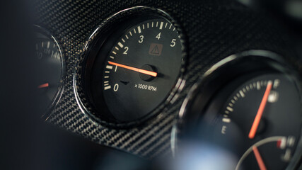 Sports car gauge close up. Racing instrument panel