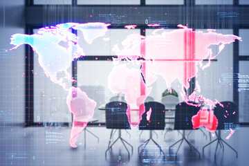 Digital world map with data overlay in modern office setting.