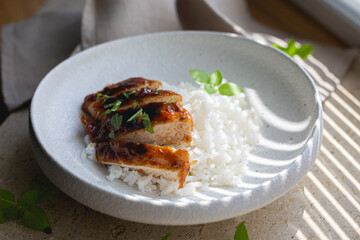Chicken fillet in sweet and sour sauce with rice