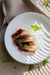 Chicken fillet in sweet and sour sauce with rice