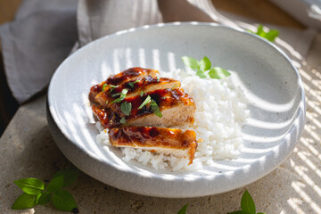 Chicken fillet in sweet and sour sauce with rice