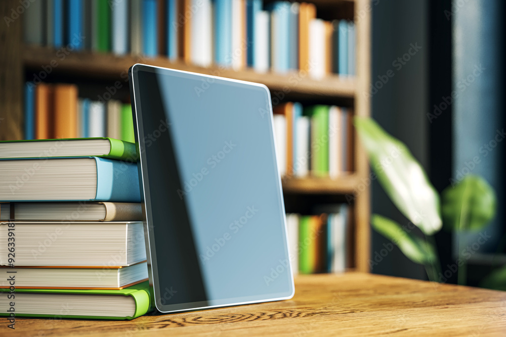 Poster Tablet and book stack on a wooden desk in a library room. 3D Rendering