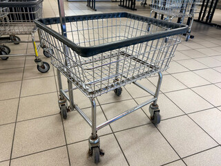 Empty Laundry Cart in a Laundromat