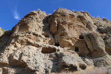 Caves in the Risco de las Cuevas, Perales de Taju&ntilde;a, Spain, ancient dwellings and storage spaces from the Roman and Medieval periods carved into the earth