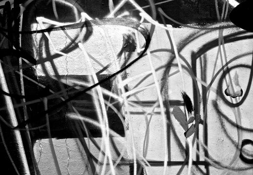 Fototapeta Abstract spray painting graffiti wall background. Random stroke line with spray. Rustic and grunge texture urban. Agitate, disturb and annoy. Black and white colors. Close up.