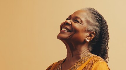 An elderly woman expresses joy with a warm smile and bright eyes