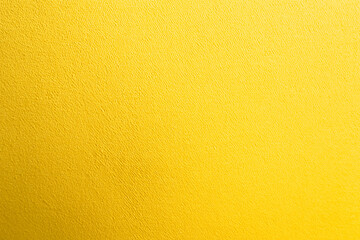 Obraz premium golden yellow paper background texture of bright yellow wallpaper, for design element, website banner background. AI generation.