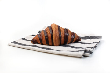 Croisant bread on a table cloth, with chocolate filling, good for recipes and articles