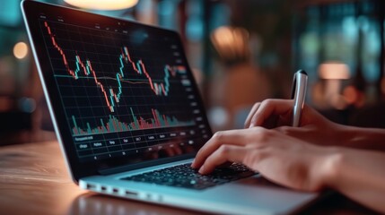 Businessman analyzing financial data on laptop screen.