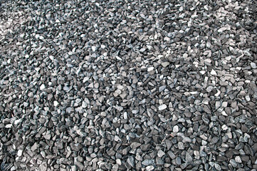 Pattern grey gravel granite texture background for mix rock concrete pattern in construction industrial. Small gray pebble on ground or floor. Vintage and retro. Close up.