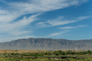Majestic Mountains and Lush Fields in Xinjiang