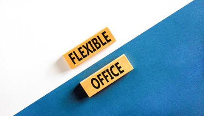 Flexible office symbol. Concept words Flexible office on beautiful wooden block. Beautiful blue and...